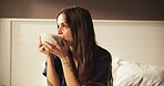 Morning, happy and woman with coffee in bed for resting, relax and wake up with warm beverage. Home, smile and comfortable person with caffeine, drink and mug in bedroom for wellness, calm and peace