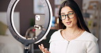Social media, vlogger and woman with ring light, live streaming and talking to fans in home and web. Online, influencer and person with tech for tips, broadcast and advice for subscribers in bedroom