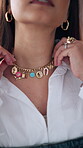Hands, woman and fashion with designer necklace for getting ready, quality check and styling. Female person, mirror reflection and jewellery to promote brand, luxury accessories and statement piece