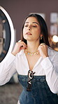 Fashion, woman and recording with ring light in home for getting ready, jewelry accessory and night. Content creation, influencer or phone to film video for social media, styling necklace or vlogging