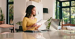 Paperwork, remote work and woman on laptop in home for website review, seo research and analytics. Freelancer, documents and person on computer with statistics, results and graph for online report