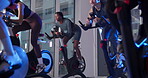 Bike, fitness and group with people in spin class for cardiovascular improvement or cycling at night. Exercise, performance and stationary spinning with athletes in gym for late evening challenge