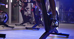 Legs, bicycle and spin class at gym with fitness, shoes and endurance with cardio for wellness. People, feet and cycling for muscle, workout and training for challenge with group at exercise club