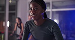 Woman, cycling and spin class at gym with smile, equipment and wellness with breathing for fitness. Person, happy and cardio with workout, training and challenge with group for exercise at club