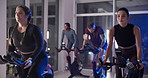 Fitness, class and people on exercise bike for cardio, body health and wellness at night. Gym, group and indoor cycling for workout, aerobic challenge and endurance training for sports with energy