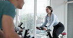 Cycling, exercise and personal trainer in spin class for cardio training, challenge or performance. Fitness, instructions and routine with woman coach in gym for endurance workout on stationary bike