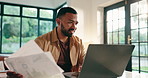 Finance, laptop and smile with remote work man in home office for financial problem solving. Computer, documents and solution with happy freelance employee in apartment for budget or investment