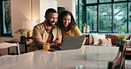 Couple, laugh and browsing on laptop at house for social medial, funny meme and bonding. Happy, people and drink juice with pc for surfing internet, streaming movies and decision on film subscription