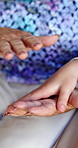 Home, senior person and care for child, holding hands or affection for grandparent, support or love. Family, together and bonding with kid in house, retirement and touch for compassion or grandma