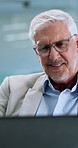 Happy, office and mature businessman on laptop for financial review, stock market and online investment. Corporate, professional worker and person on computer for finance report, budget and profit