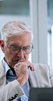 Business, thinking and man in workplace, laptop and online reading for audit report. Mature person, employee and financial consultant with pc, choice or decision for investment and email with revenue