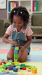 Building blocks, playing and child on floor in home for game, creativity and fine motor skills. House, girl and African kid with educational toys for learning, problem solving and construct tower