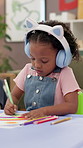 School, kid and drawing with headphones for learning, education and creative audio. Student, art and girl child with color for cognitive development, sketching rainbow and music for artistic skills