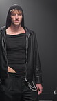 Event, fashion show and stage with model man on runway for launch or premiere of clothing line. Creative, design and style with person in clothes outfit on catwalk for studio presentation or showcase