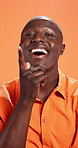 Thinking, face or black man in studio with solution, insight or lightbulb moment by orange background. Eureka, happy person or African male model with inspiration or perspective for creative thought