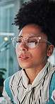 Reading, glasses and business woman on computer in office for research, finance review and graphs. Corporate, thinking and person with reflection on tech for financial data, statistics and investment