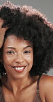 Woman, afro and face with hair care in studio for touch, texture and confidence by background. Mature person, smile and excited for results, change and portrait with growth for hairstyle in Brazil