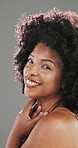Face, skincare and black woman with smile, profile and dermatology on grey studio background. African person, afro and healthy skin with grooming, beauty or wellness with natural cosmetics and shine