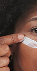 Face cream, beauty and black woman with skincare for natural, health or facial routine with hydration. Closeup, glow and African person with lotion, spf or moisturizer for dermatology treatment.