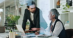 Coaching, business people and laptop in office, conversation and research for article. Employees, man and mature woman in workplace, pc and planning with advice, feedback and collaboration with ideas