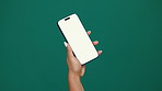 Person, hands and phone screen with mockup space in studio for advertising or marketing. User, model or showcase with mobile smartphone for new app, social media platform or UI on a green background