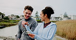 Fitness, workout and couple fist bump with phone outdoor for training, social media post and performance. People, celebration and tracking app on bridge for runner, success and cardio or exercise