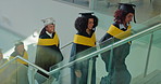 Students, group and happy on stairs for graduation, success or goal with education at college. People, walking and steps with smile, excited or celebration for achievement with university scholarship