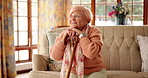 Nursing home, thinking and old woman with cane, remember or pensioner with Alzheimer in living room. Happy, reflection and senior person with disability in lounge, dementia and smile for memories