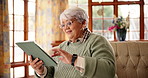 Wow, tablet and relax with old woman on sofa for bingo app, online game or connection. Jackpot prize, virtual dealer and digital cards with elderly person in living room of home for gambling payout