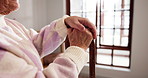 Hands, walking stick and senior woman in home for support, rehabilitation or parkinson disease. Arthritis, retirement and elderly female person with disability with cane for mobility aid in house.