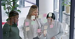 Glass wall, planning and business women in office for problem solving on finance project. Brainstorming, team and female financial advisors with ideas on board for investment proposal in workplace.