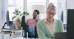 Lazy employee annoying his coworker in the office. Man sitting with his legs up on his desk throwing papers and irritating his female colleague. Male making his manager angry at the workplace