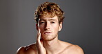 Studio, man and face with touching for skincare, dermatology and confidence with smile for beard. Mockup space, male person and model in portrait for cosmetics, smooth and hygiene in gray background