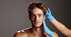 Man, face and injection for plastic surgery in studio with lines, aesthetic and change by background. Person, cosmetic surgeon and transformation in portrait, dermal filler and mockup space in Spain