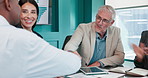 Business people, success and handshake in meeting, investor and b2b deal with stock market goals. Employees, group and financial team with agreement, shaking hands and achievement with partnership