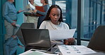 Office, info and woman with laptop for data entry, bookkeeper and records of financial transactions. Typing, digital report and accountant with documents for administration, read or serious with tech