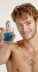Face, happy man and spray perfume for fragrance, hygiene and fresh scent. Portrait, luxury cologne and model with cosmetics product for beauty, self care and clean smell on white studio background