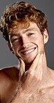 Happy, beard and grooming with face of man in studio for growth, shine and self care. Cosmetics, beauty product and smile with male person on gray background for glow, treatment and facial hair