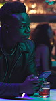 Disappointed, man and waiting with phone in nightclub for date, delay or rendezvous. Upset, male person or frustrated customer with mobile smartphone in bar or pub for night out, fail or cancel