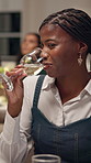 Happy woman, drinking and champagne with date for fine dining or hospitality in restaurant. Female person, customer or guest with smile, glass or tasting alcohol for conversation, chat or dinner