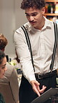 Waiter, menu and advice with man in restaurant for discussion, dinner option and hospitality. Food service, fine dining and server with people at table for cuisine, customer experience and order