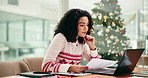 Woman, laptop and documents at Christmas in office with review, feedback and charts at finance company. Person, computer and paperwork at xmas with statistics, graph and report for revenue at agency