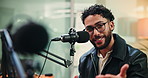 Man, talk and face with mic for podcast with broadcast, happy and radio show at media company. Person, presenter and portrait with discussion, platform and live stream at creative agency in Brazil