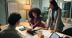 Night, business people and discussion with laptop for chart, investment proposal and idea in office. Late, data and group in meeting with paperwork for financial planning, risk management or analysis