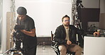 Set, people and creative for film shoot, production and cameraman for cinematography, art or visual. Teamwork, director and men with equipment for movie, artist and direction for scene in studio