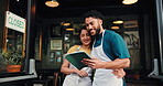 Waiter, team and talk with tablet at coffee shop, hug or happy with review, results or profit at front door. Man, woman and barista with embrace, tech or app for success, smile or sales data at diner