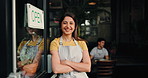 Happy woman, face or waitress with open door in cafe for customer service or ready for business. Portrait, female person or smile with confidence or arms crossed for entrepreneurship in coffee shop