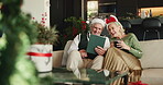 Christmas, coffee and tablet with old couple on sofa in living room of home for online shopping. App, ecommerce and festive with senior people in apartment to search internet for holiday gifts