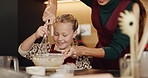 Whisk, baking and mother with child in kitchen for cooking, teaching or bonding in home together. Ingredients, learning and mom with girl kid for preparing dessert, cookies or cake for snack in house