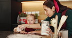 Happy, baking and mother with kid in kitchen for learning, bonding or cooking together in home. Laugh, teaching and mom with girl child for preparing cookies, cake or dessert with flour in house.